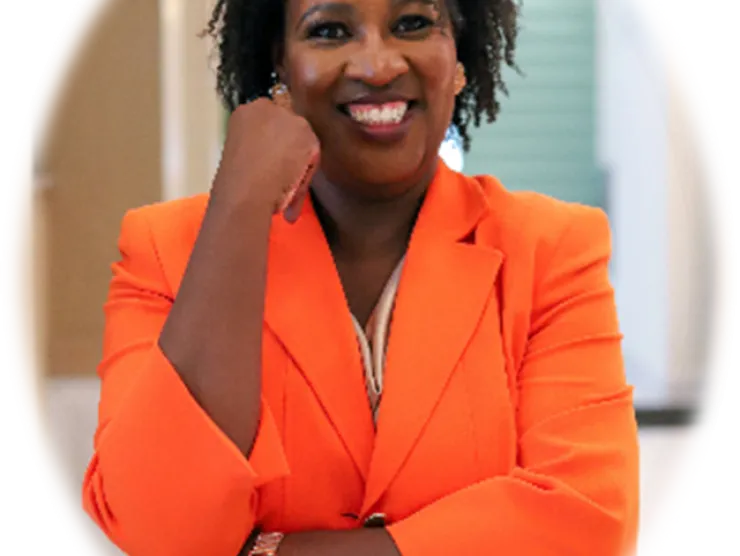 Woman in orange dress smiling