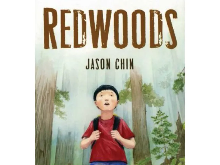 Cover of Redwoods by Jason Chin.  The setting is a slightly foggy redwood forest.  A young Asian boy stands in the middle with his hands on his backpack straps.  He wears a red t-shirt and jeans.  He looks up in wonder.