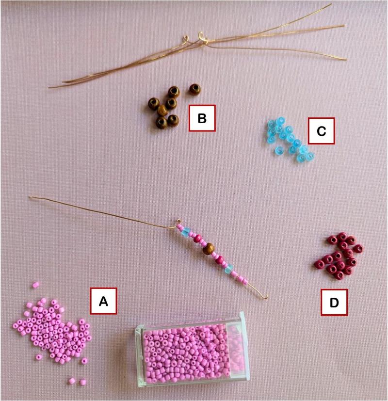 A photo of the 4 kinds of beads used to make the spider's legs, labeled for the pattern