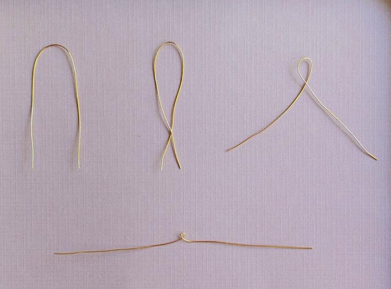 4 gold wires in a progression of stages, showing how to form a loop in the middle