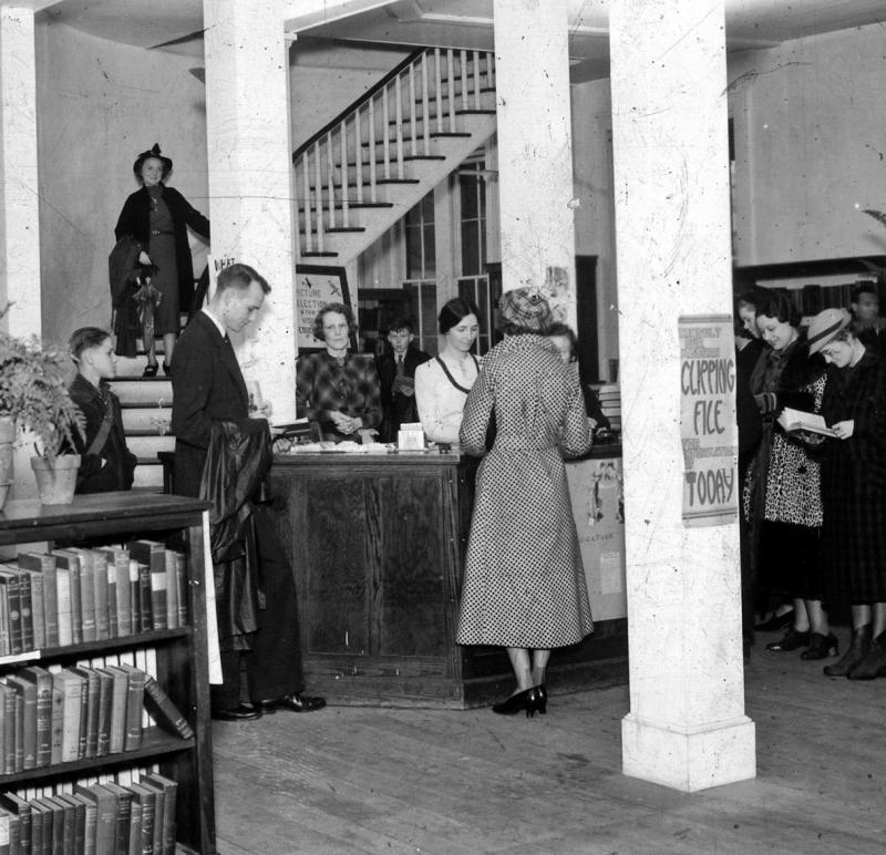 Lucy Hampton at the desk, Richland County Public Library, 1937