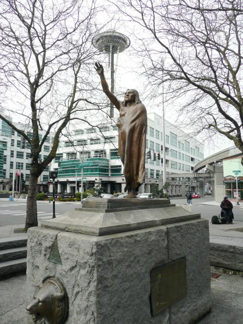 Statue of Chief Si'ahl with the Seattle Space Needle in the background