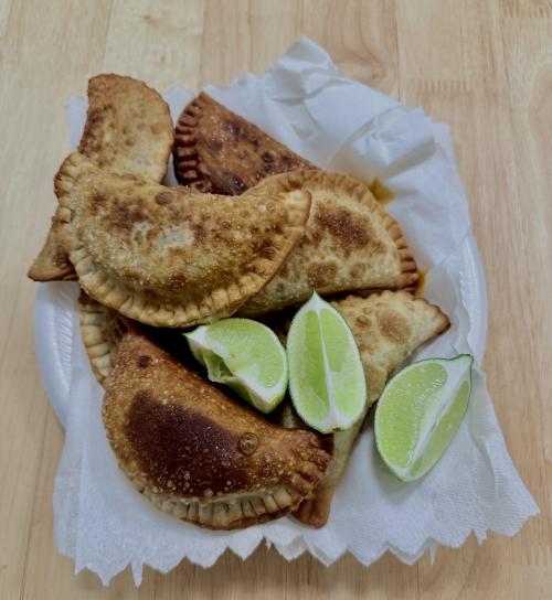 Fried empanadas with lime