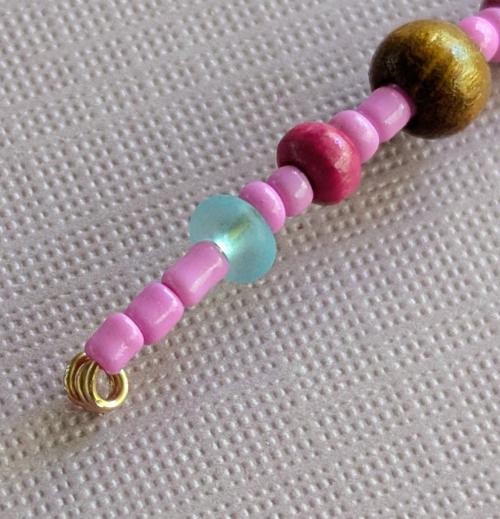 Close up of the end of one beaded spider's leg