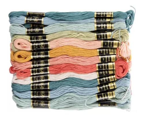 over a dozen skeins of embroidery floss in multiple colors