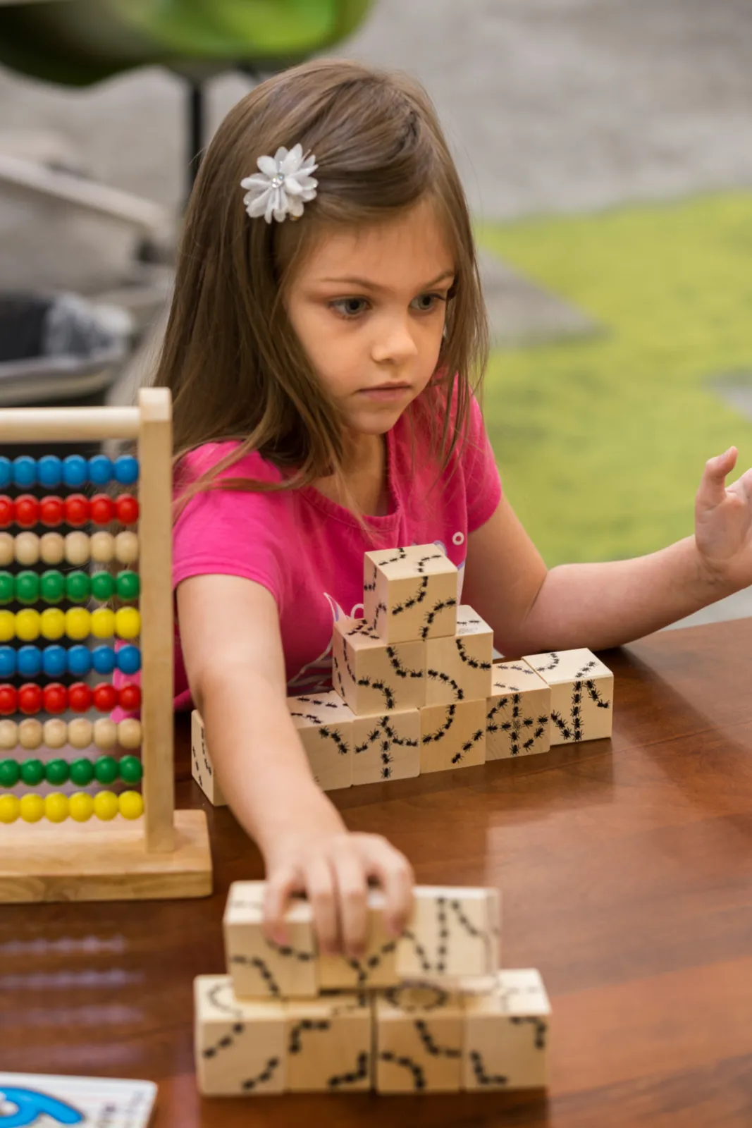 Girl building with blocks.