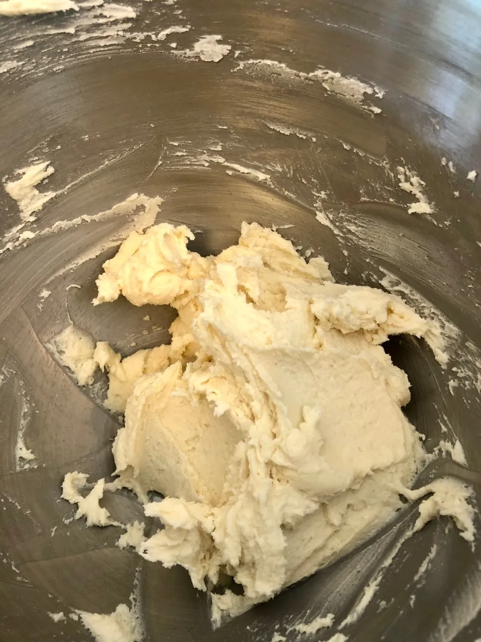 An image of lemon bar crust dough in a mixing bowl