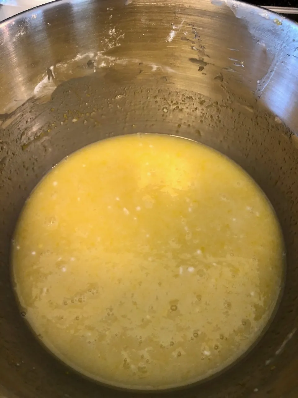 An image of the filling mixture for the lemon bars in a mixing bowl