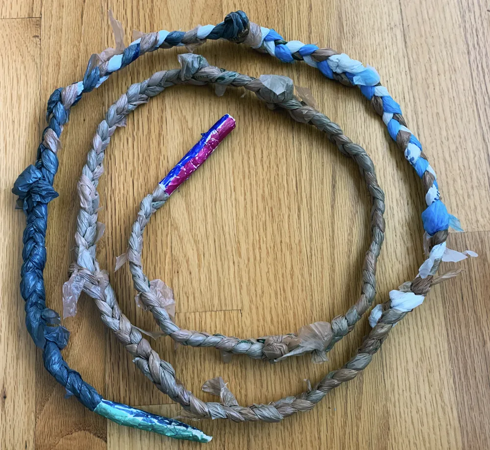 An image showing a curled up finished jump rope made of plastic grocery bags