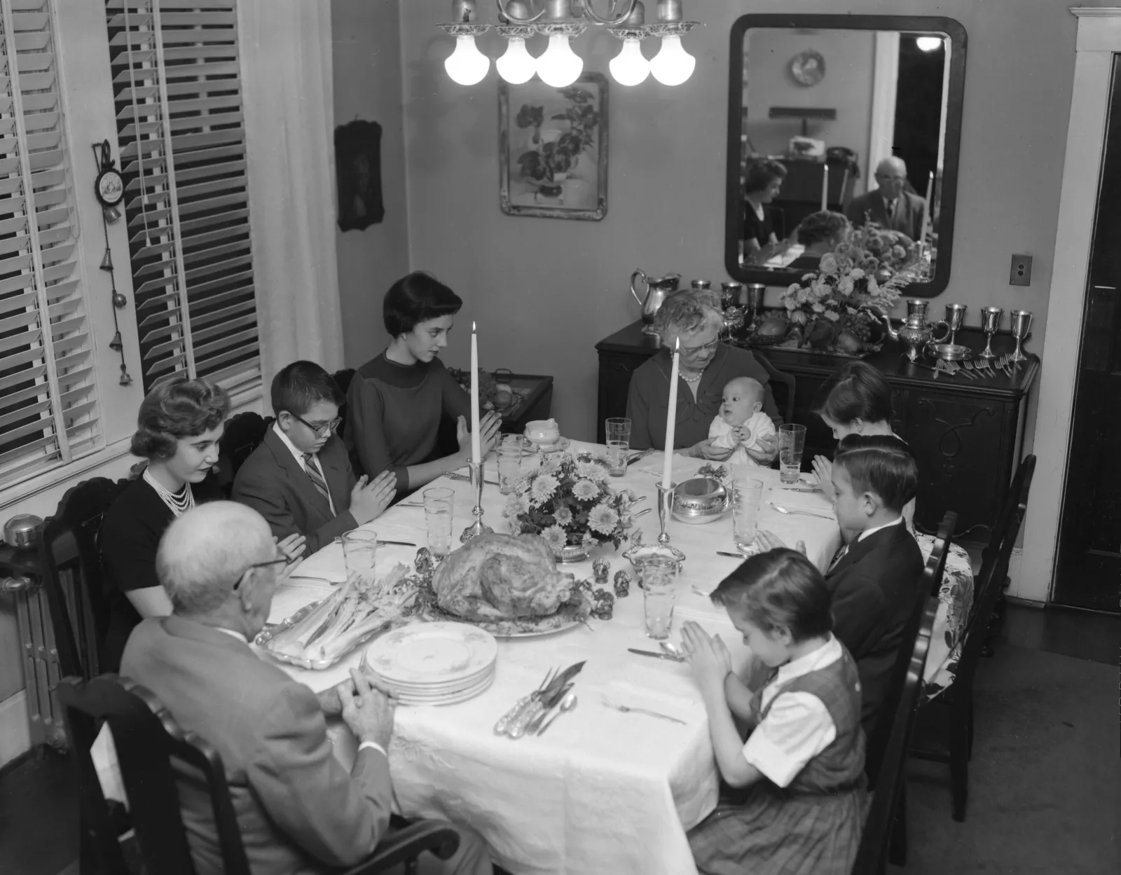 Image of Dr. T. L. Timmons and his family at the Thanksgiving table.