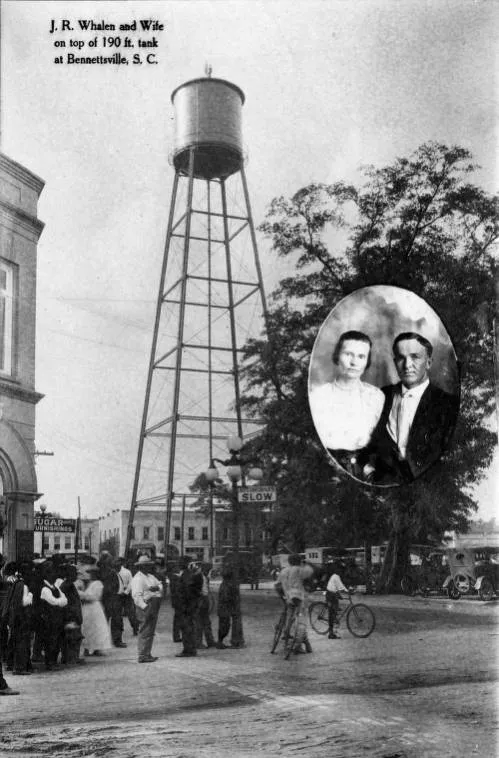 J. R. Whalen and wife atop tank
