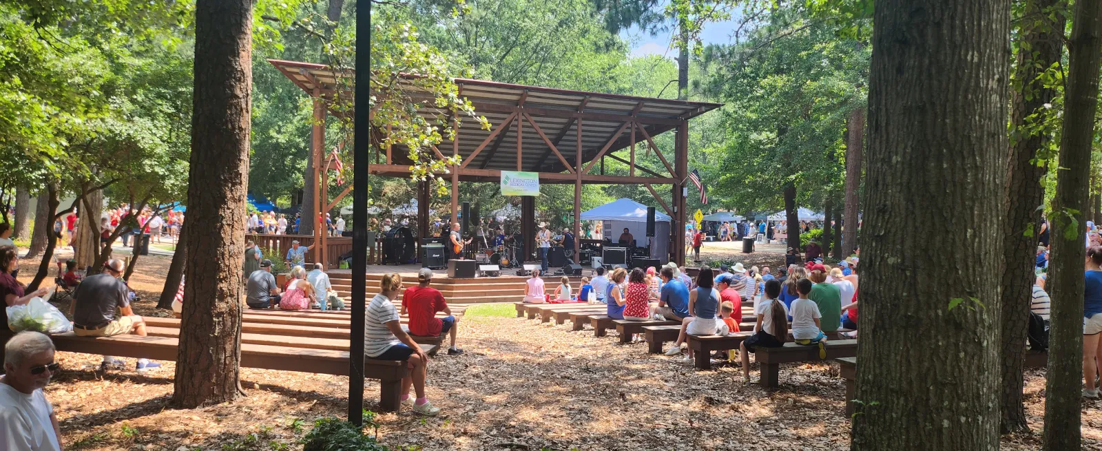 outdoor amphitheater with american flags