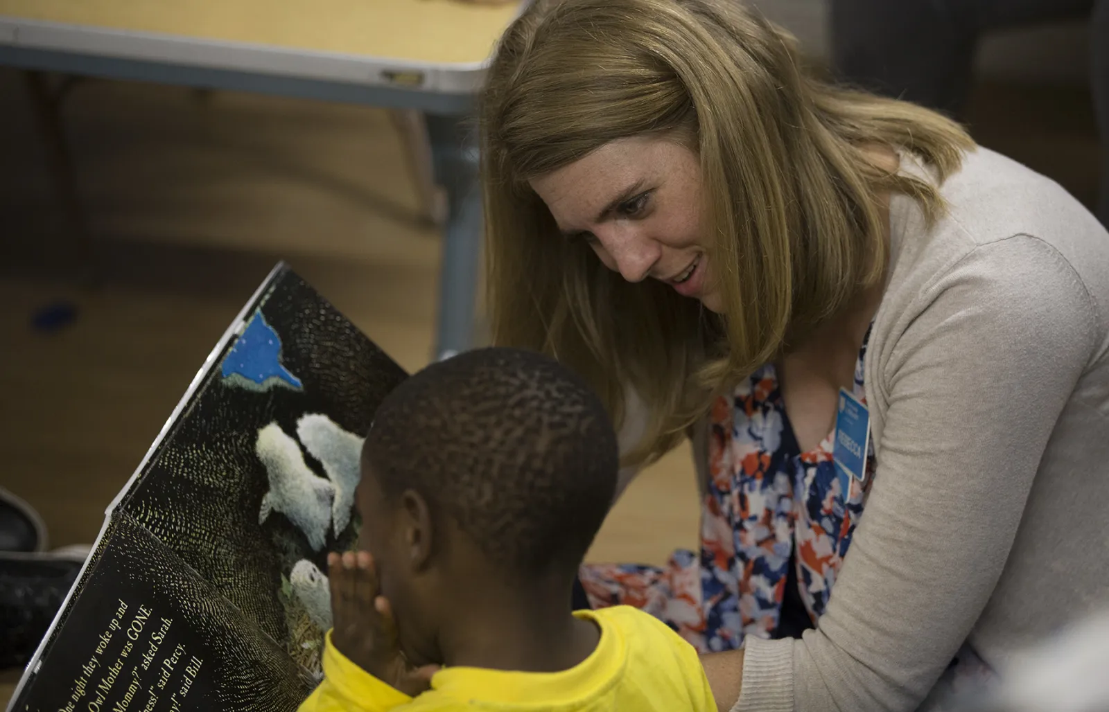Woman and child reading a book