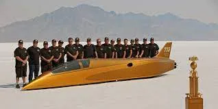 Picture of the race car with crew member