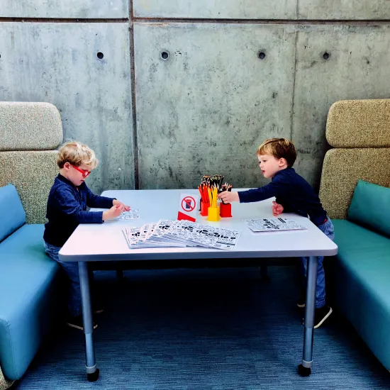 Two boys work in the Education Studio 