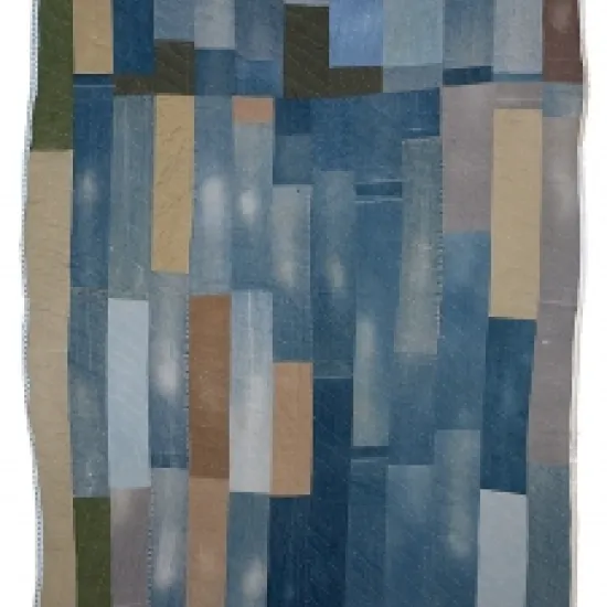 a blue and grey quilt made from old worked-in denim by Annie Mae Young