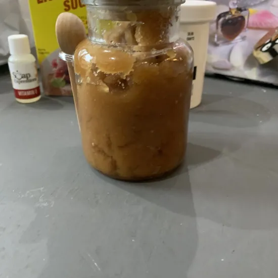 small decorative bottle with wooden stopper, filled brown sugar body scrub
