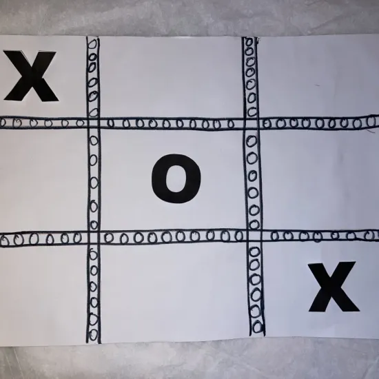 Black and White Tic Tac Toe Board with Xs and Os 