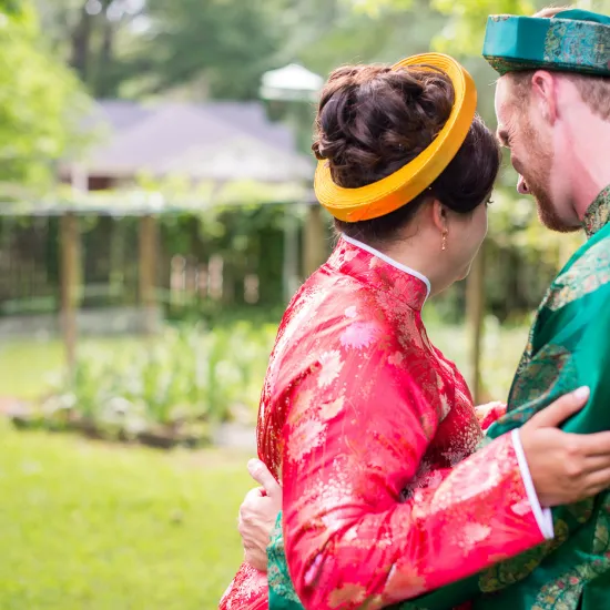 a couple in traditional Vietnamese wedding attire 