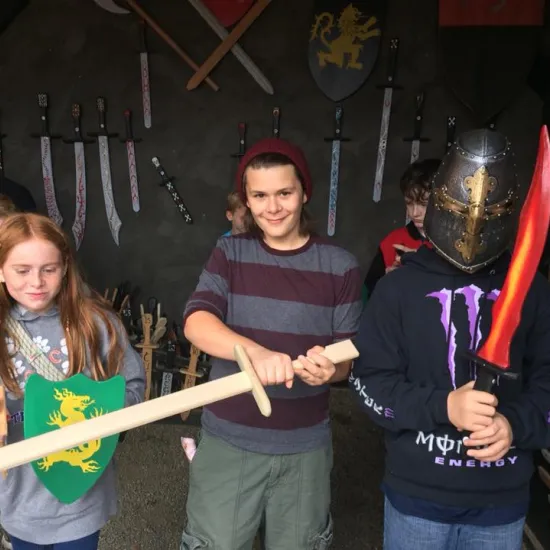 Children playing with medieval props