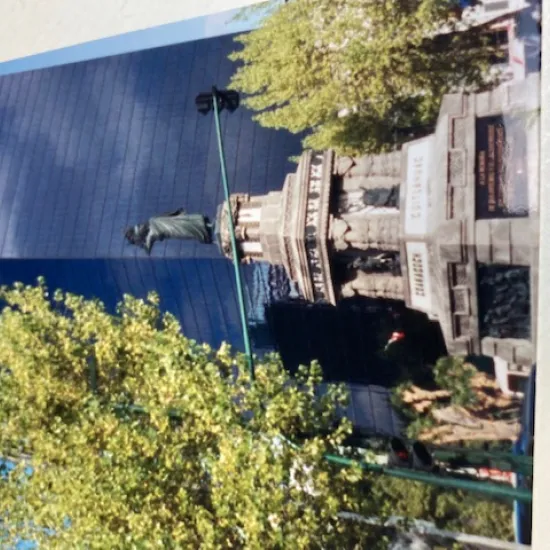 Old statue with new building