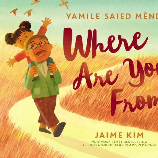 Cover of Where Are You From? features a grandfather walking on a dirt path with his granddaughter on his shoulders.  Fields of long, brown grass are on either side and birds fly into the sky.  The granddaughter looks happy and has her arms outstretched and her grandfather smiles.