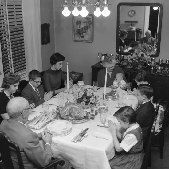 Image of Dr. T. L. Timmons and his family at the Thanksgiving table.