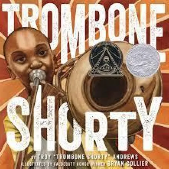 Book cover of Trombone Shorty, child playing trombone with Coretta Scott King medal and Caldecott Honor medal affixed to right side.
