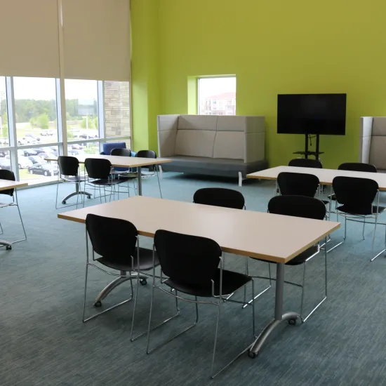 Large meeting room with tables and chairs