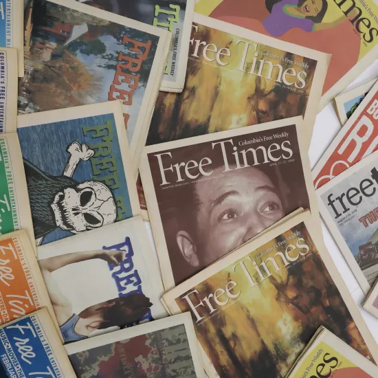 Multiple issues of Free Times newspapers arranged in a collage, showing a variety of cover designs, headlines, and artwork from different years.